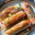 Crispy Air Fryer Spring Rolls served on a plate, golden brown and delicious.