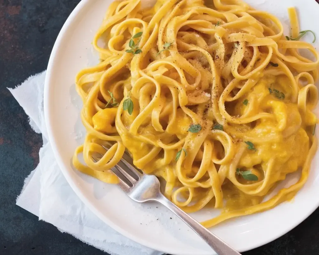 Vegan Butternut Squash Pasta Sauce served over whole grain linguine with herbs.