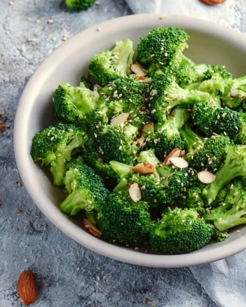 Sesame Garlic Broccoli served in a bowl with sesame seeds and garlic
