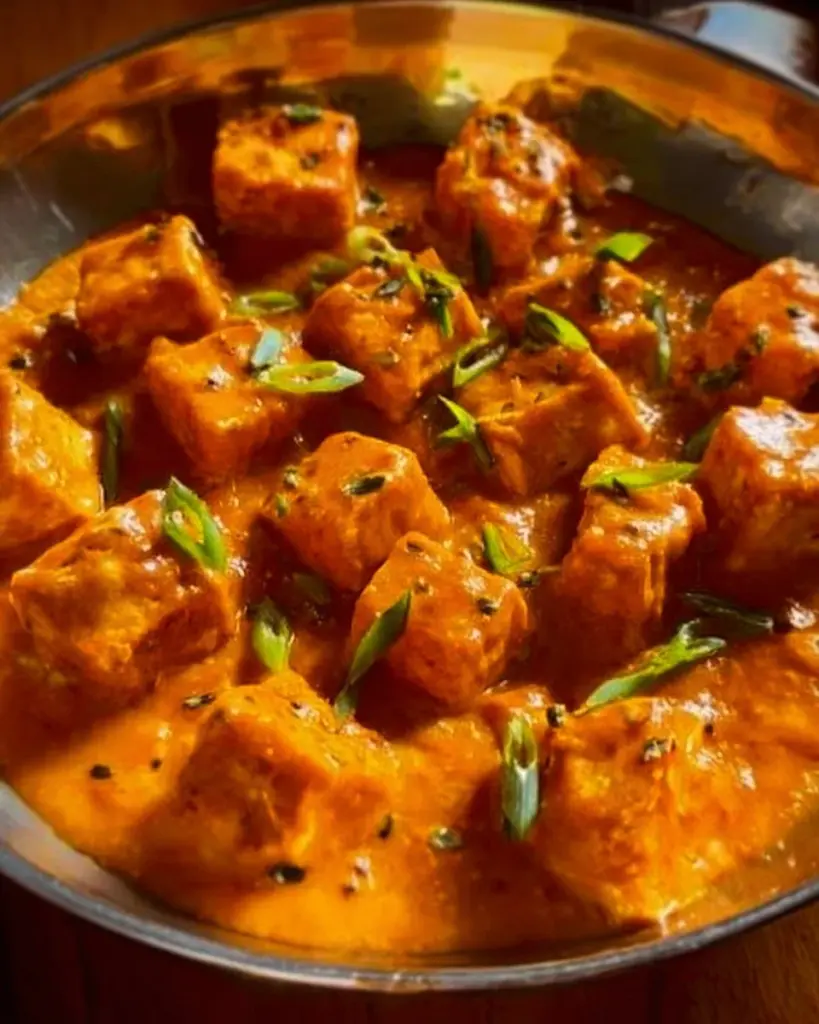 Delicious creamy spicy tofu dish served with fresh vegetables.