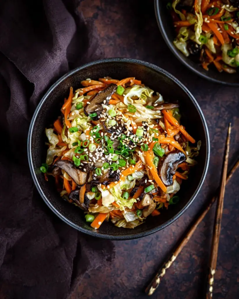 A colorful Egg Roll in a Bowl with vegetables and protein served in a dish.