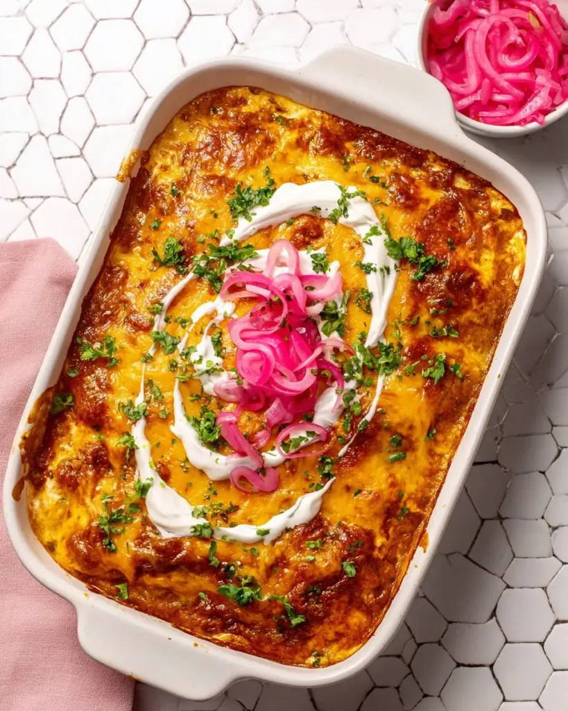 Delicious chicken enchilada casserole served in a baking dish